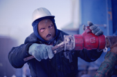 Worker dressed against the cold. BP oil field. Endicott Is. Prudhoe Bay, Alaska. 1989
