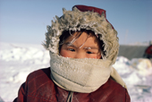 Young Inuit girl wrapped up against the cold. Igloolik, Nunavut, Canada. 1987