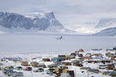 A Dash-8 Aircraft on final approach to land at the Inuit community of Pangnirtung. Nunavut, Canada. 2008