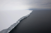 The Ice cliff edge of the Ross Ice Shelf which stretches for 600km shows ice blink & water skies. Antarctica
