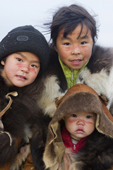 Chukchi girls, with their family's ancestral clan mark painted in reindeer blood on their face, a ritual during the Chukchi 'Festival of the Young Reindeer.' Iultinsky District, Chukotka, Siberia, Russia.
