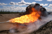Burning off impure gas in the Gazprom's Yamsavey gas fields near Nadym. Yamal, Western Siberia, Russia. 2000