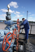 Worker adjusts a valve in a gas pipeline in Gazprom's Yamsavey gas fields near Nadym. Yamal, W.Siberia, Russia. 2000
