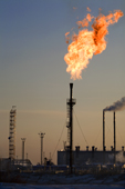 A gas flare at a Gazprom oil production facility near Noviy Urengoy. Yamal, Western Siberia, Russia