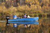 Selkup hunter,Igor Kubolev, & his girlfriend Rita travelling by boat on the River Shirta in the autumn. Krasnoselkup, Yamal, Western Siberia, Russia