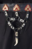 A detail of the back of a Komi reindeer herder's belt. The bear's tooth hanging from it is an amulet to protect the wearer from evil. Similar belts are also worn by the Nenets and Khanty. Yamal, Western Siberia, Russia