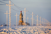 Snow covered power lines lead to a gas drilling derrick near Sabetta in the South Tambey Gas Field. Yamal Peninsula, NW Siberia, Russia.