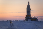 A gas drilling derrick at sunset in the South Tambey gas field. Yamal Peninsula, NW Siberia, Russia