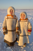 Two Komi sisters, Ksusha (left) and Albina Valeeva, wearing traditional reindeer skin clothing. Priuralsky District of the Yamal. NW Siberia, Russia