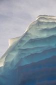 A backlit iceberg showing its semi-translucent blue and turquoise layers. Foyn Harbour, Antarctic Peninsula.