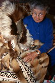 Inupiaq woman, Lela Oman, shows the calf skin trim on her traditional coat. Nome. Alaska. 1997