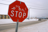 A stop sign in Iqaluit, the capital of Nunavut, in both English and Inuktitut syllabics. Nunavut, Canada. 2002