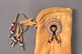 A Cree moosehide glove decorated with beadwork. Northern Quebec, Canada. 1988