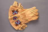 A pair of embroidered Cree moosehide gauntlets. Northern Quebec, Canada. 1988