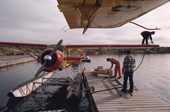 Cree refuelling a float plane, at Mistassini. Quebec, Canada. 1988
