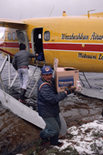 Cree, Abel Brien, unloading supplies from an Otter DHC-3 float plane on Lake Bourinot. Quebec. Canada. 1988