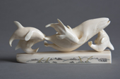 A carving of a Bowhead whale being attacked by killer whales made from walrus ivory. Chukotka, Russian Far East