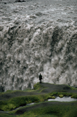 Tiny figure by Dettifoss, the most powerful waterfall in Europe. Iceland. 1992