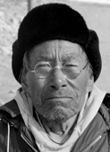 Asapanguaq, an elderly Inuk from Qaanaaq in spectacles and hat, Thule, Northwest Greenland. 1971