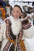 Valya, a Nenets woman, using a mobile phone. Yamal, Northwest Siberia, Russia.