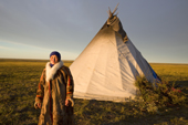 Dina Laptander outside her family's tent at a Nenets reindeer herders' summer camp. Yamal Peninsula, NW Siberia, Russia