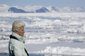 Stylish older woman enjoys an arctic adventure cruise to Spitsbergen